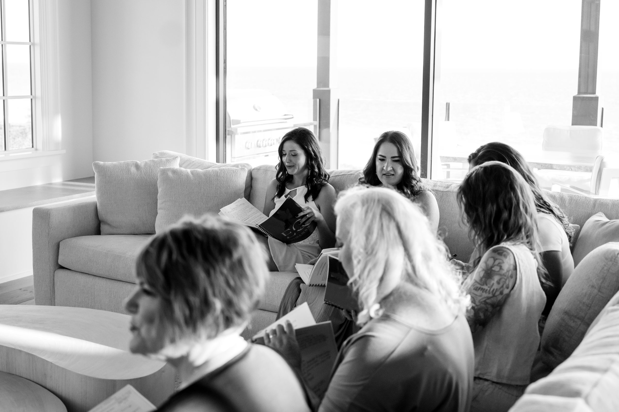 Women in conversation on sofas during a coaching session
