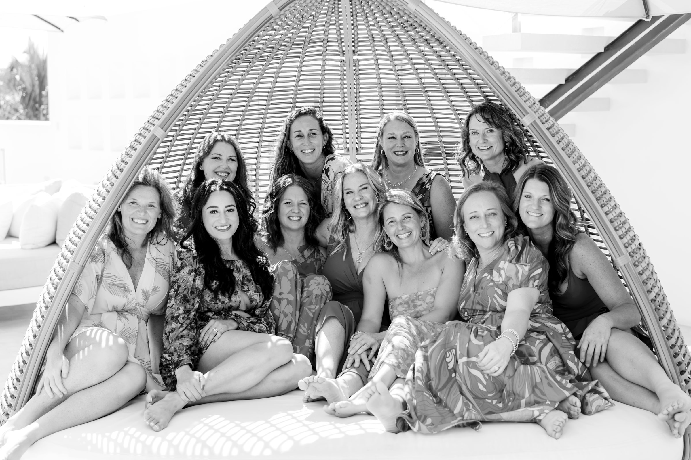 The retreat group gathered together in a large woven cabana