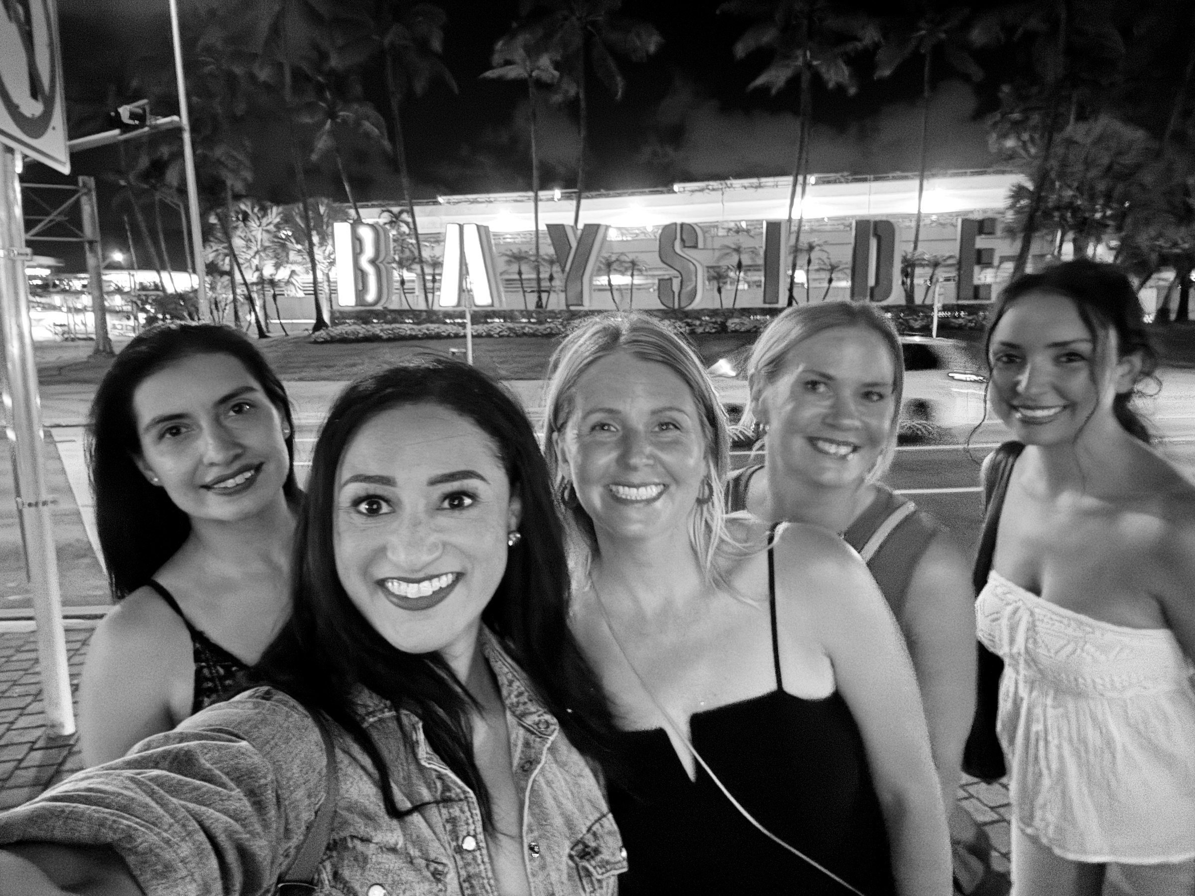 Five women together at night on the Miami retreat